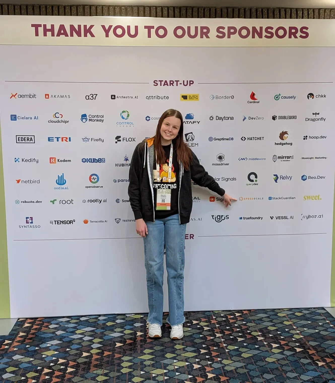 photo taken in front of startup banner
