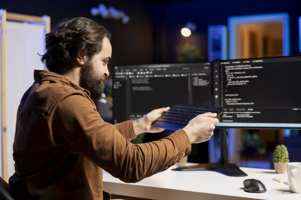 Dev holding keyboard